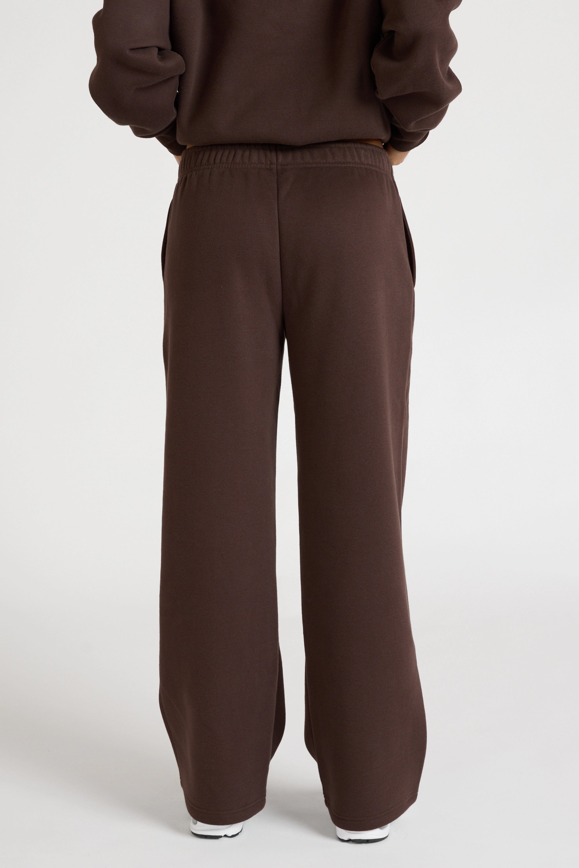 Espresso brown jumper and wide leg trackpants on a white background