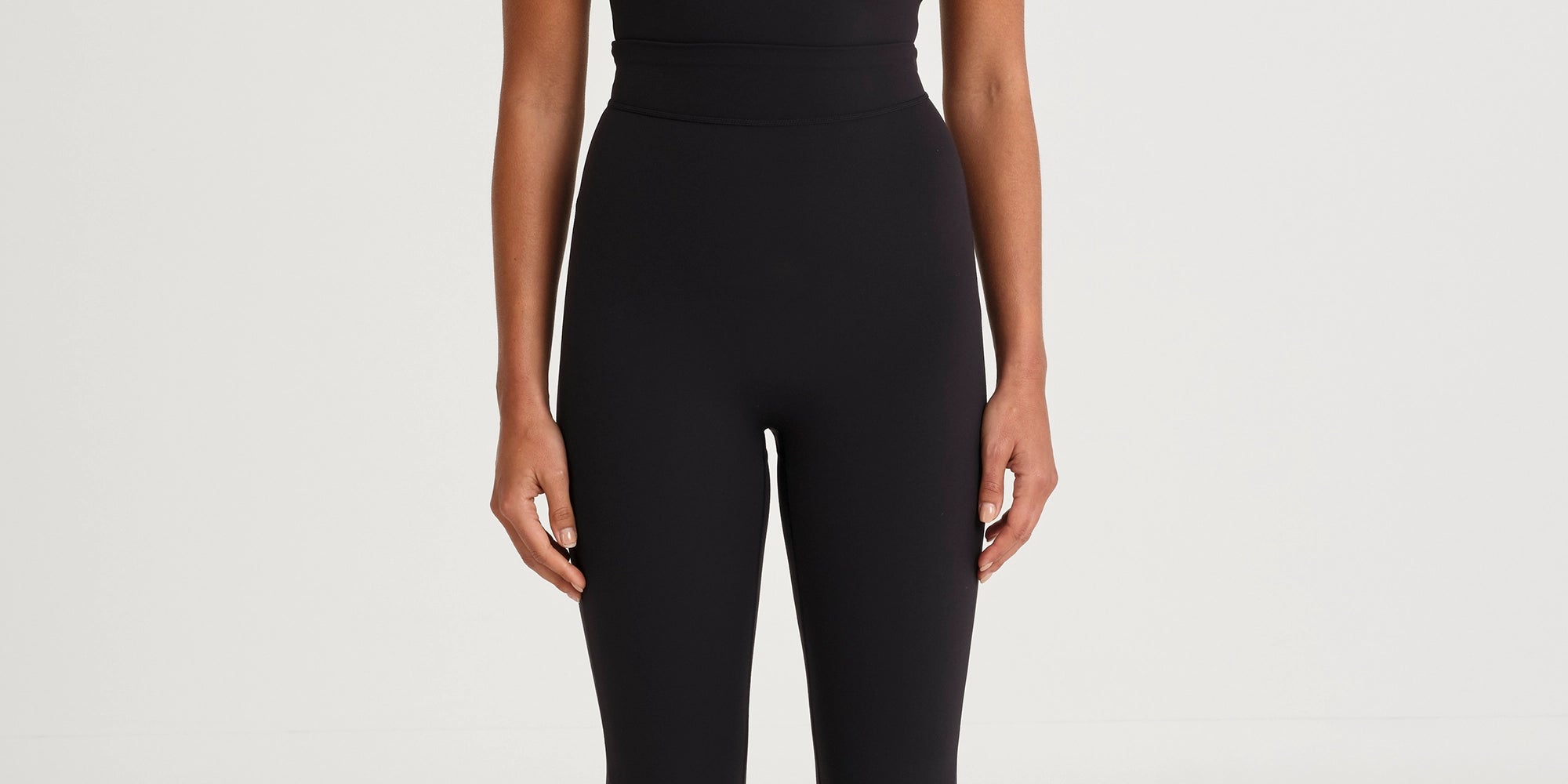 A4R198_CloudCoreScoopNeckFlareJumpsuit_Front_Blk.webp