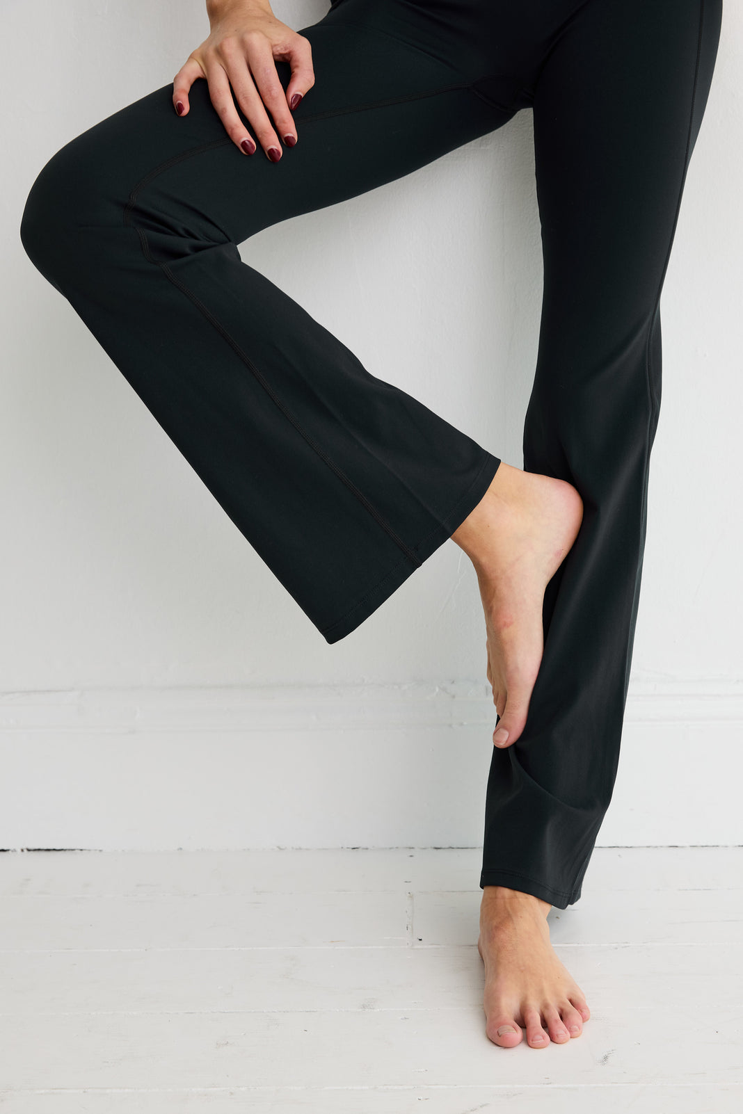 ALLFENIX CloudCore Flared Legging in Black — side view