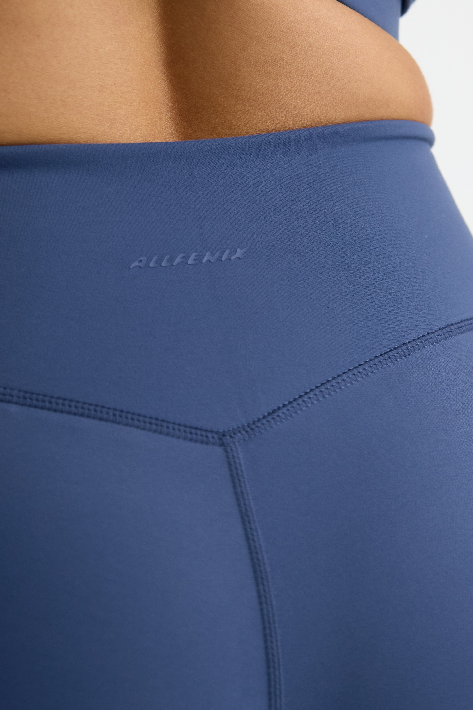 ALLFENIX CloudCore 7/8 Legging in Blue Indigo — flat lay