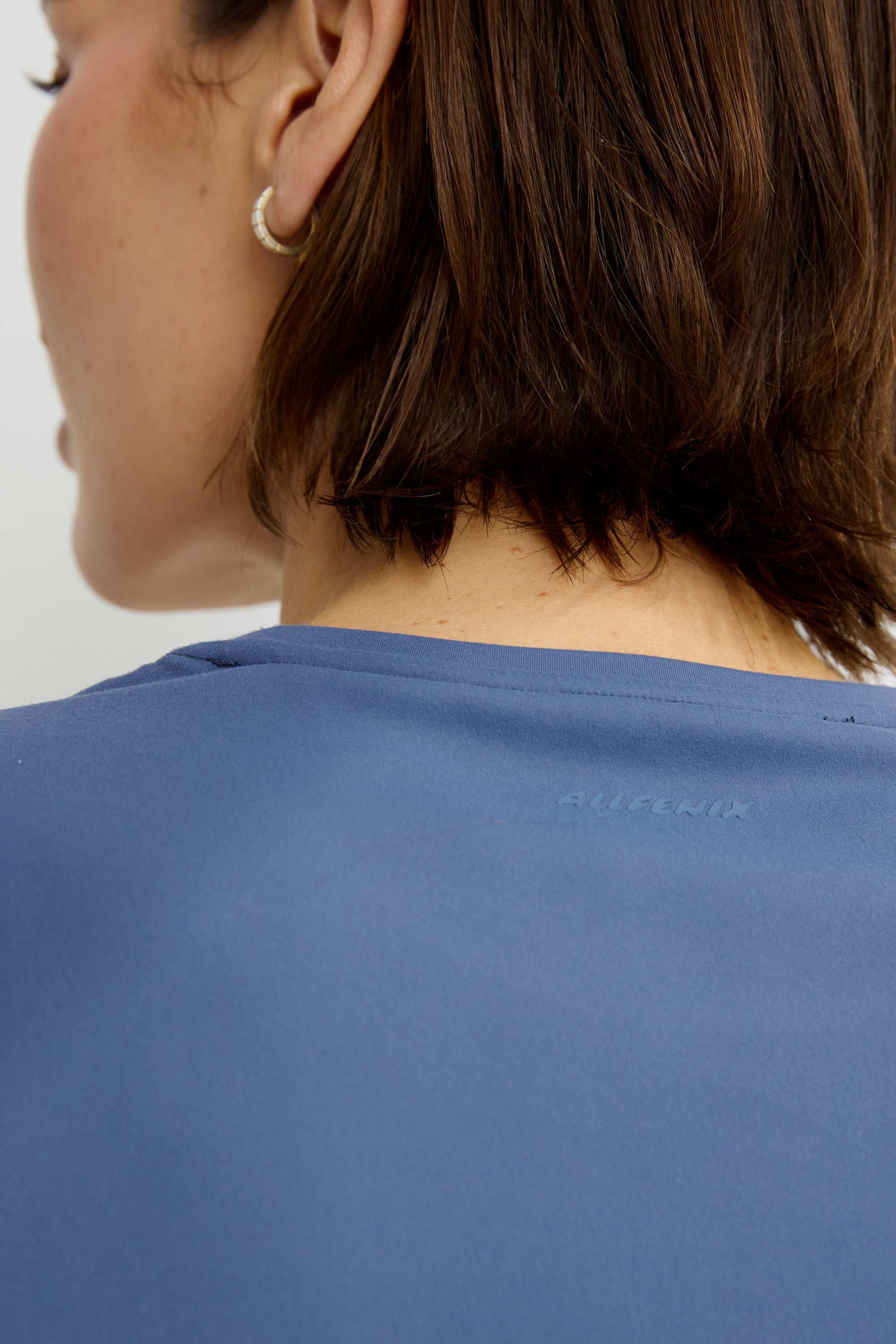 ALLFENIX CloudCore Lite Tee in Blue Indigo — movement shot