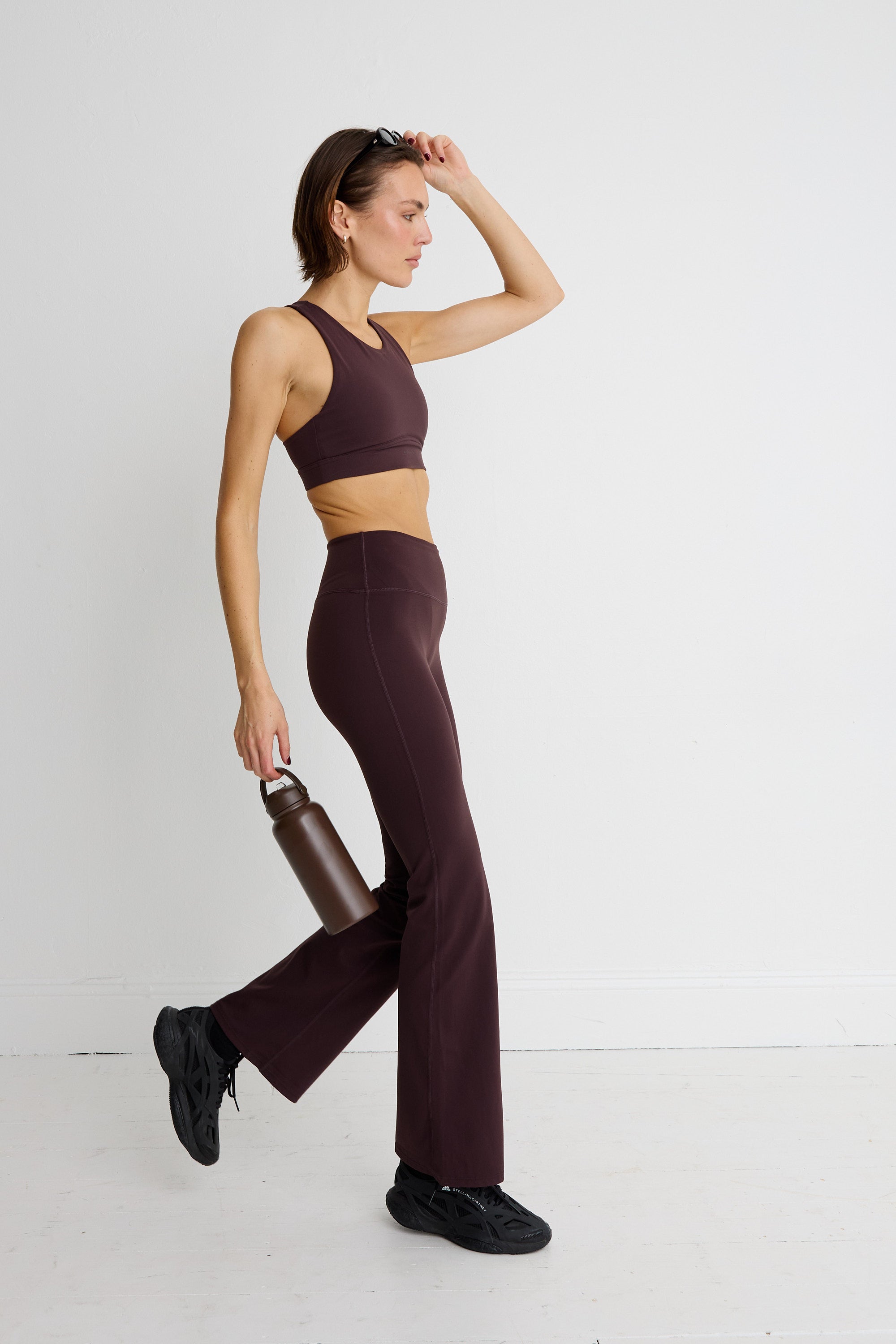 ALLFENIX CloudCore Flared Legging in Double Espresso — styled view