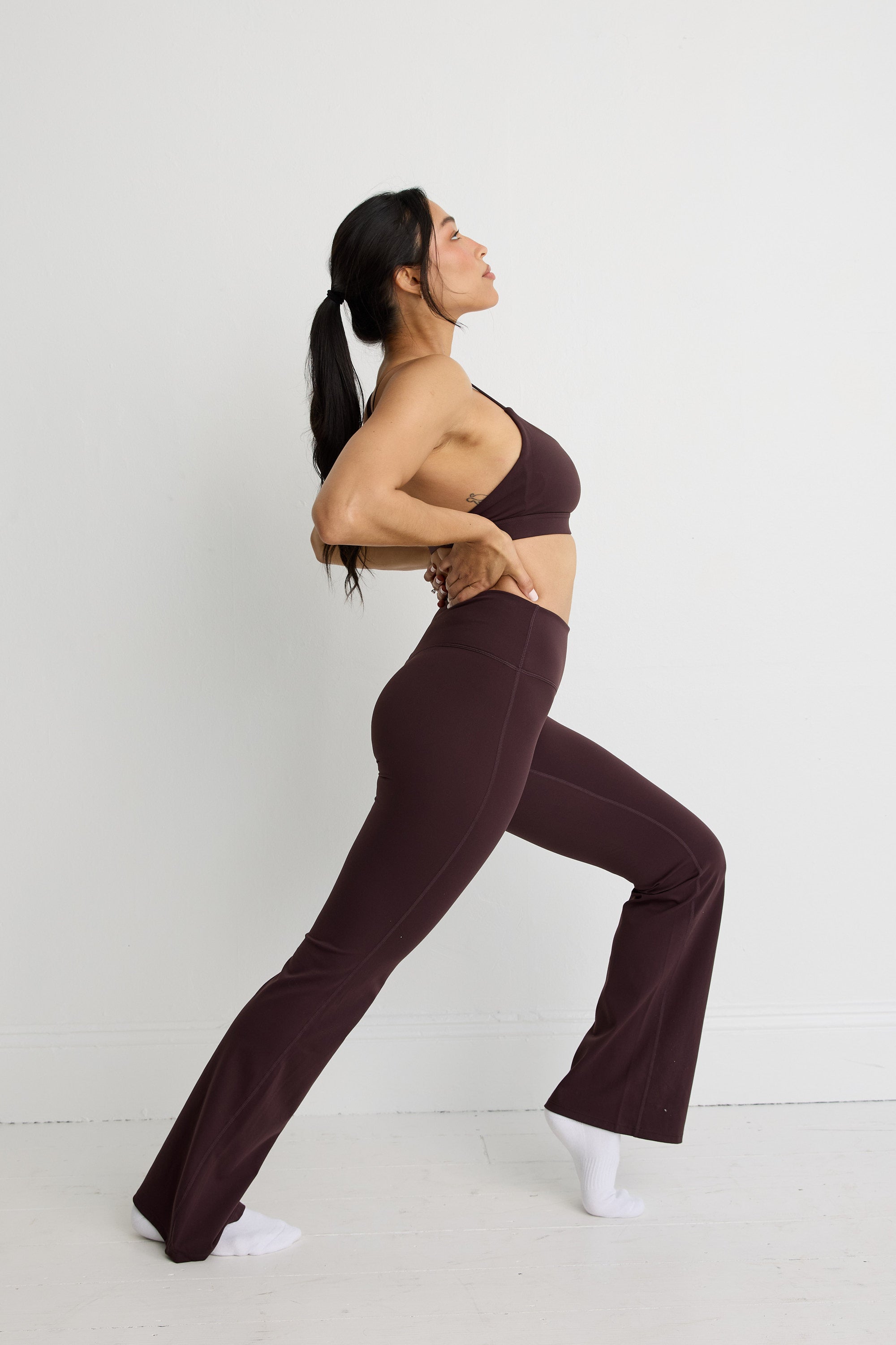 ALLFENIX CloudCore Flared Legging in Double Espresso — studio view